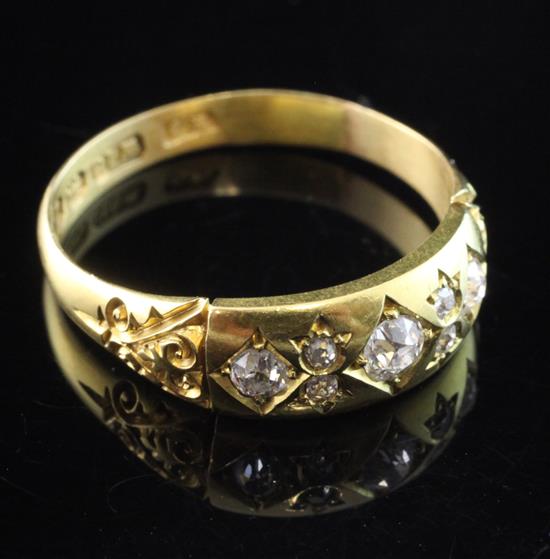 A late Victorian 18ct gold and gypsy set six stone diamond ring, size T.